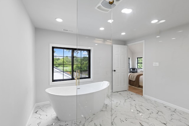 226 Ruane St, Fairfield, CT 06824 - full bathroom with marble tiled floors, ensuite bathroom, a freestanding tub, and recessed lighting
