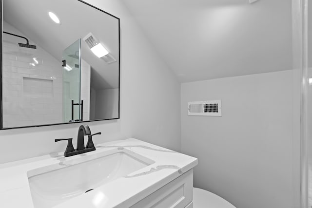 226 Ruane St, Fairfield, CT 06824 - bathroom featuring vaulted ceiling, vanity, and a stall shower