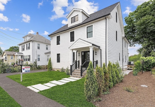 226 Ruane St, Fairfield, CT 06824 - american foursquare style home with a front lawn and roof with shingles