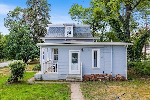 22 Benjamin St, Norwich, CT 06360 - back of property with a yard, a shingled roof, and mansard roof