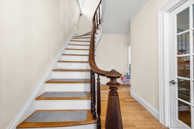 22 Benjamin St, Norwich, CT 06360 - stairs featuring wood finished floors and ornamental molding