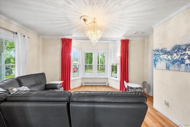 22 Benjamin St, Norwich, CT 06360 - living area with wood finished floors, a chandelier, ornamental molding, and baseboard heating