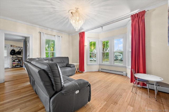 22 Benjamin St, Norwich, CT 06360 - living room with a chandelier, crown molding, light wood-style flooring, and a baseboard radiator