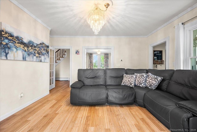22 Benjamin St, Norwich, CT 06360 - living area featuring a chandelier, stairway, wood finished floors, crown molding, and baseboard heating