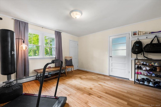 22 Benjamin St, Norwich, CT 06360 - workout room with light wood-style floors, a baseboard heating unit, and ornamental molding