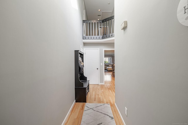 2289 Bedford St Unit F2, Stamford, CT 06905 - hallway featuring wood finished floors and a towering ceiling