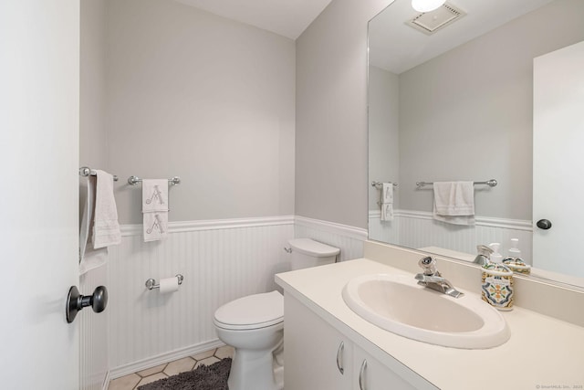 2289 Bedford St Unit F2, Stamford, CT 06905 - bathroom with a wainscoted wall, vanity, and tile patterned flooring