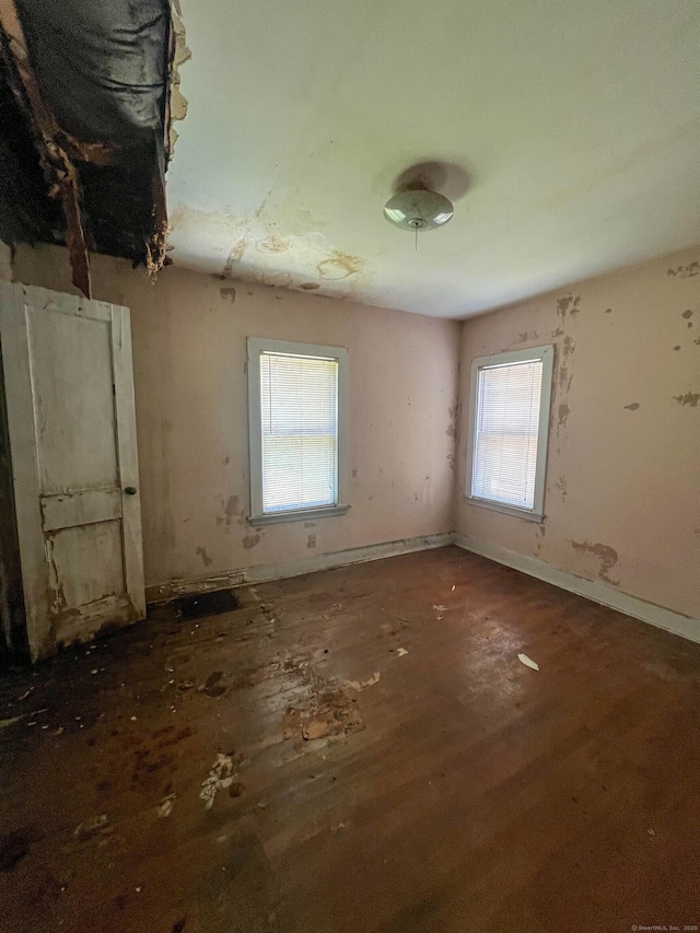 130 Wilkins Ave, Bridgeport, CT 06606 - empty room featuring plenty of natural light and wood finished floors