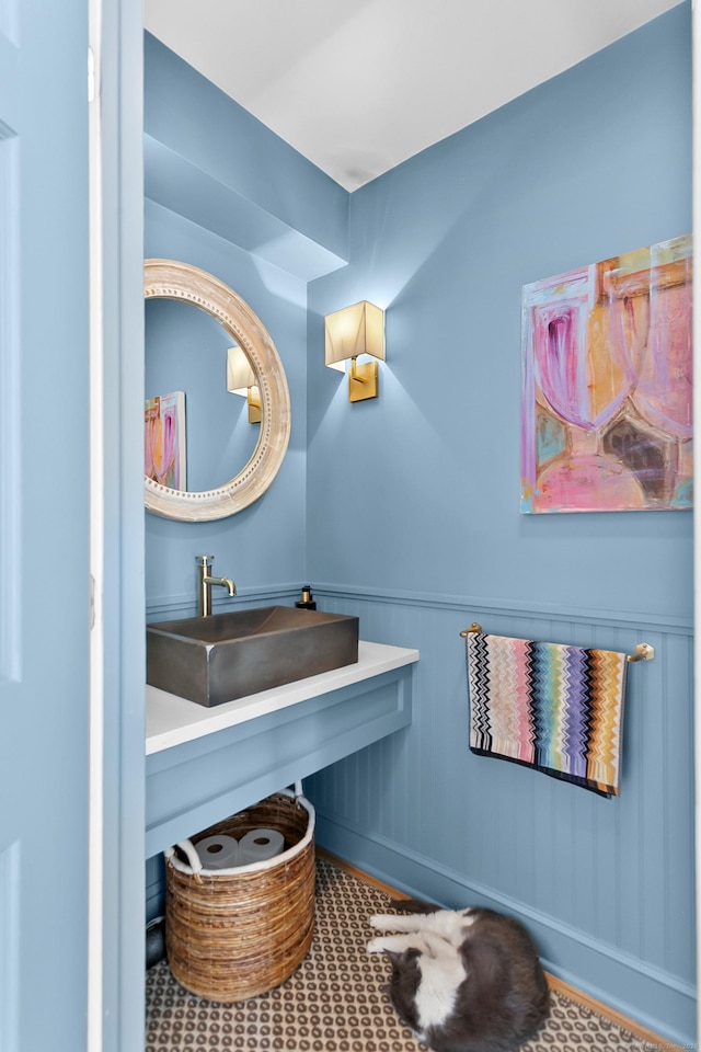 521 Lake Ave, Bridgeport, CT 06605 - bathroom featuring a sink and a wainscoted wall