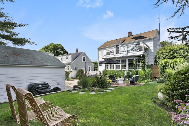 521 Lake Ave, Bridgeport, CT 06605 - back of property with a balcony and a chimney