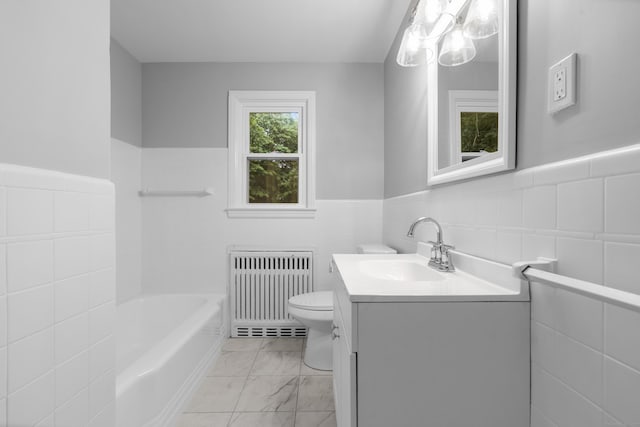106 Lakeview Ave, West Haven, CT 06516 - full bath with radiator, tile walls, vanity, marble look tiles, and a wainscoted wall