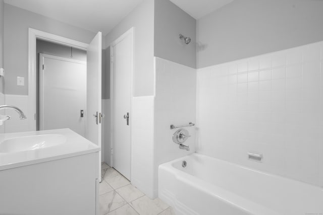 106 Lakeview Ave, West Haven, CT 06516 - bathroom with vanity, wainscoting, washtub / shower combination, and marble finish flooring