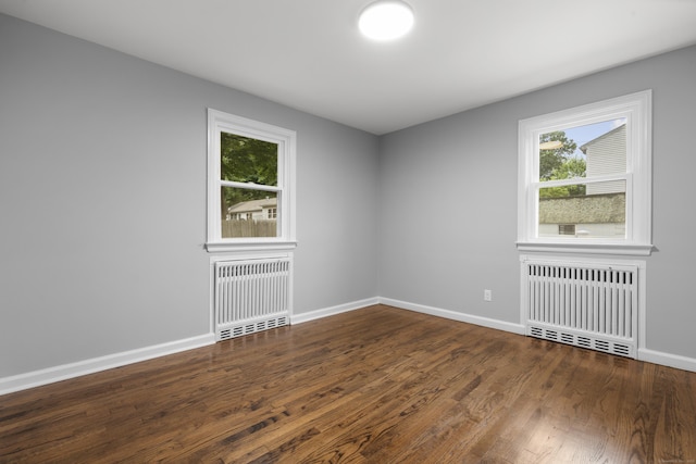 106 Lakeview Ave, West Haven, CT 06516 - spare room featuring radiator heating unit and wood finished floors