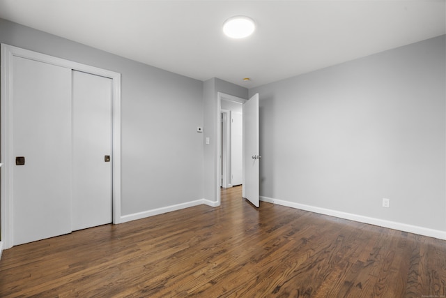 106 Lakeview Ave, West Haven, CT 06516 - unfurnished bedroom with wood finished floors and a closet