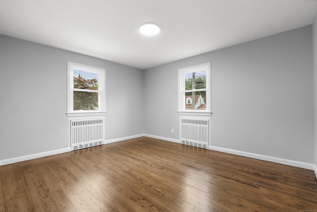 106 Lakeview Ave, West Haven, CT 06516 - unfurnished room with radiator heating unit, healthy amount of natural light, and wood finished floors