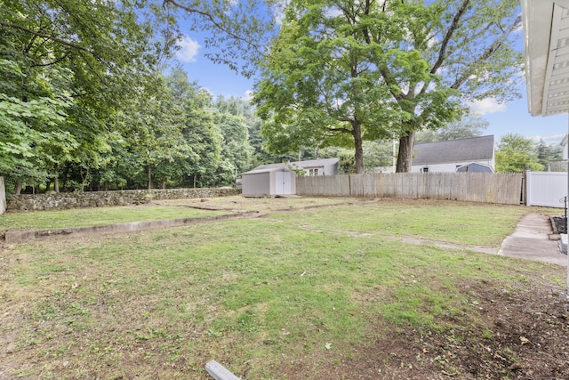 106 Lakeview Ave, West Haven, CT 06516 - fenced backyard featuring a storage unit