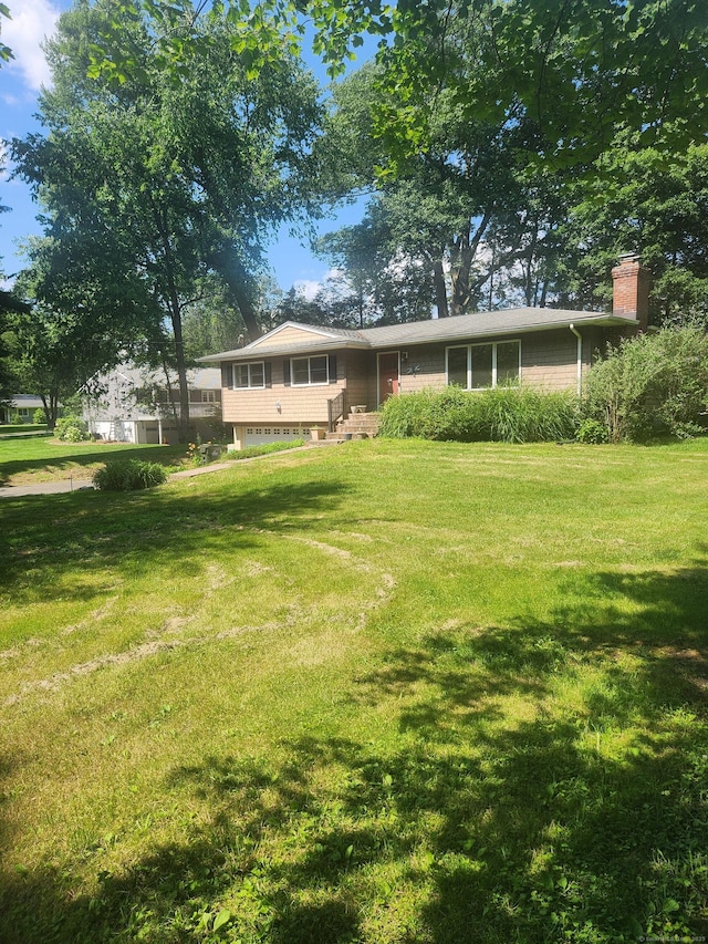 15 Juniper Rd, Newtown, CT 06470 - rear view of house featuring a lawn and a chimney