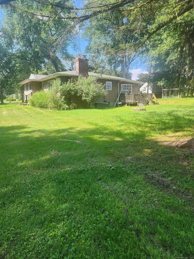 15 Juniper Rd, Newtown, CT 06470 - view of green lawn with a wooden deck