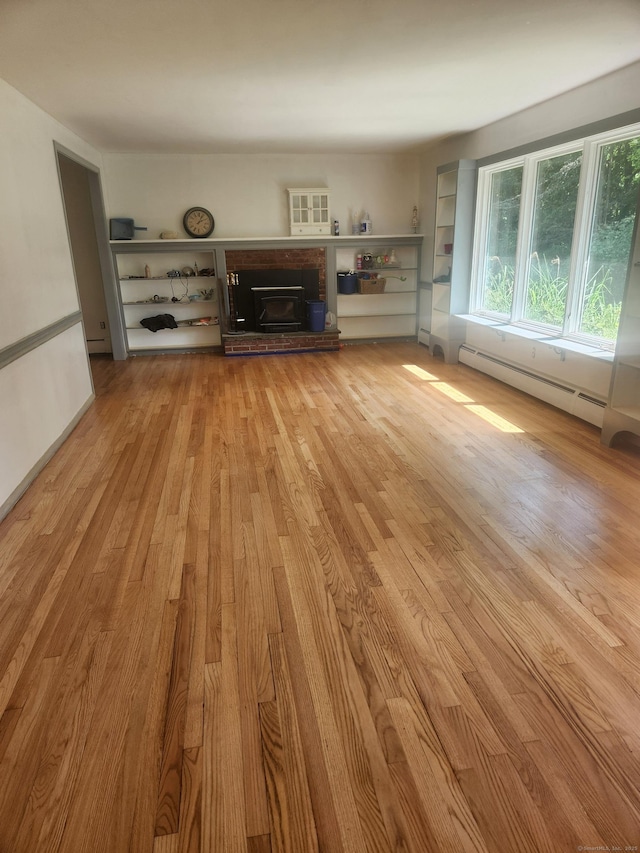 15 Juniper Rd, Newtown, CT 06470 - unfurnished living room featuring light wood finished floors, baseboard heating, and a brick fireplace