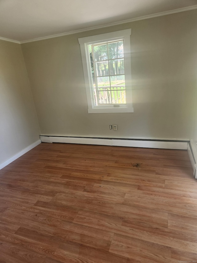15 Juniper Rd, Newtown, CT 06470 - spare room featuring ornamental molding, baseboard heating, and wood finished floors