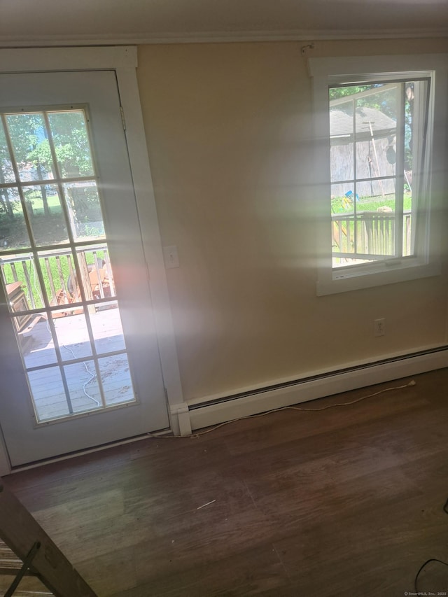 15 Juniper Rd, Newtown, CT 06470 - empty room with a baseboard heating unit, ornamental molding, healthy amount of natural light, and wood finished floors