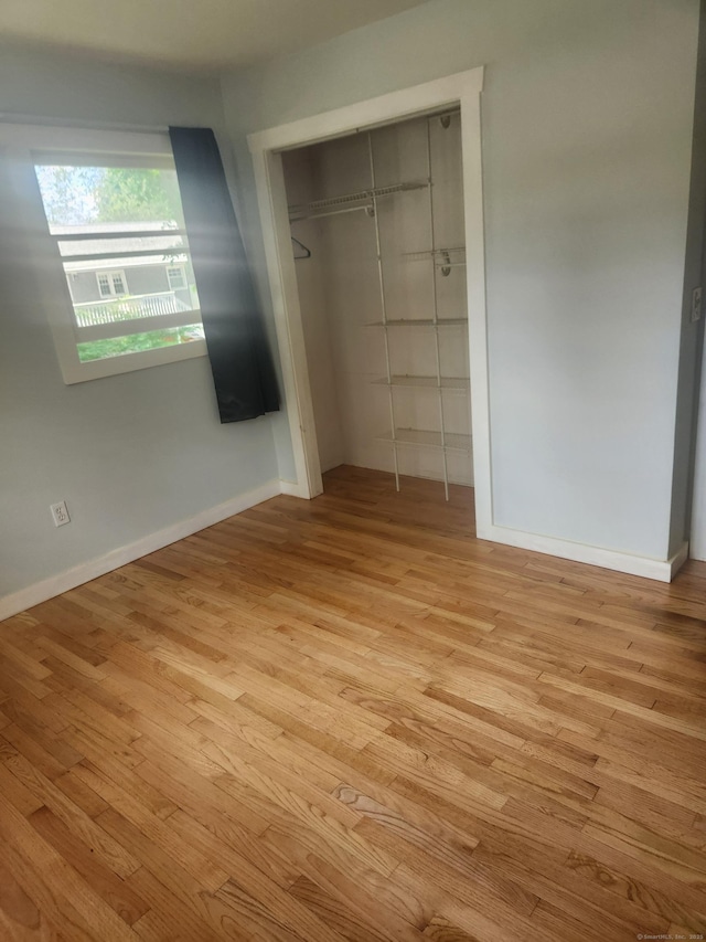 15 Juniper Rd, Newtown, CT 06470 - unfurnished bedroom featuring wood finished floors and a closet