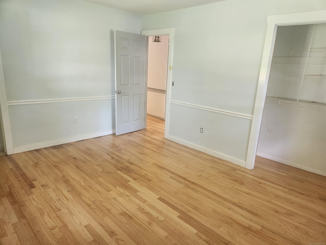 15 Juniper Rd, Newtown, CT 06470 - unfurnished bedroom featuring light wood-style flooring and a closet