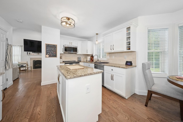 357 D Welton Way, Thomaston, CT 06787 - kitchen with a kitchen island, wood finished floors, and white cabinets