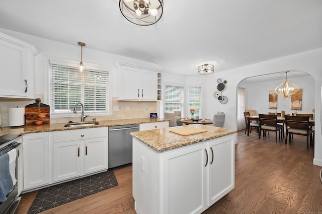 357 D Welton Way, Thomaston, CT 06787 - kitchen with a chandelier, arched walkways, wood finished floors, appliances with stainless steel finishes, and white cabinetry