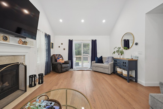 357 D Welton Way, Thomaston, CT 06787 - living room with wood finished floors, a tile fireplace, high vaulted ceiling, and recessed lighting