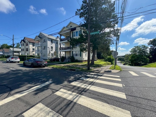 150 Greenwood St, New Britain, CT 06051 - view of asphalt road with traffic signs, sidewalks, and a residential view