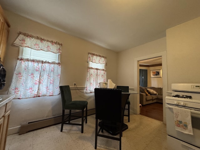 150 Greenwood St, New Britain, CT 06051 - dining space featuring a baseboard heating unit and light floors
