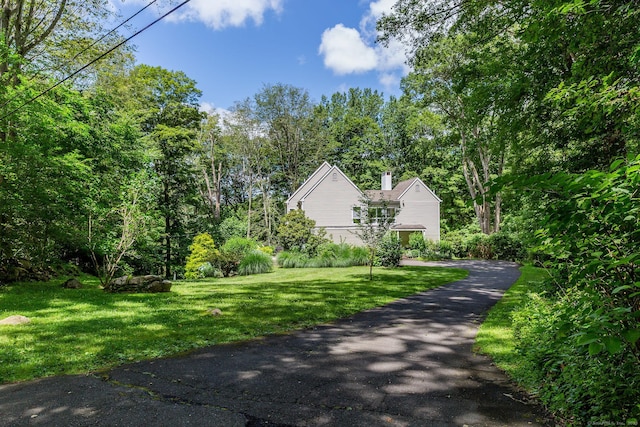 48 Deer Hill Dr, Ridgefield, CT 06877 - view of home's exterior featuring a yard and a chimney