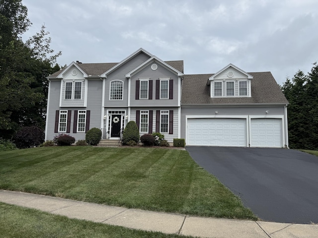 23 Falmouth Ct, Middletown, CT 06457 - view of front of home with driveway, roof with shingles, and a front lawn