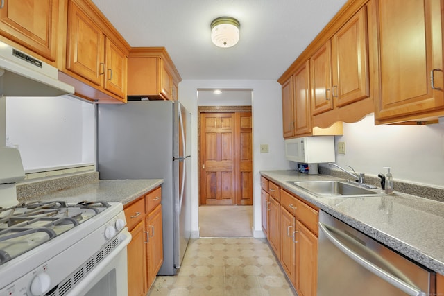 106 Brookwood Dr Apt D, Rocky Hill, CT 06067 - kitchen with appliances with stainless steel finishes, light flooring, exhaust hood, brown cabinetry, and light countertops