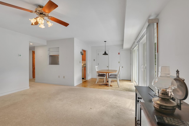 106 Brookwood Dr Apt D, Rocky Hill, CT 06067 - living room with light carpet and a ceiling fan