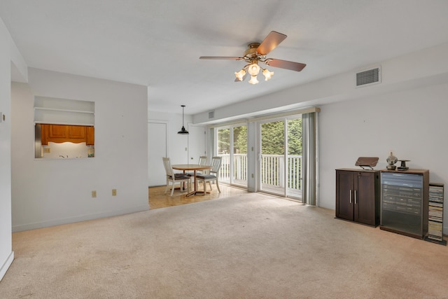 106 Brookwood Dr Apt D, Rocky Hill, CT 06067 - carpeted living room with a ceiling fan and beverage cooler