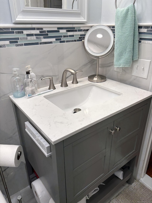 55 Mill Plain Rd Unit 17-6, Danbury, CT 06811 - bathroom with vanity, tile walls, tile patterned flooring, and tasteful backsplash