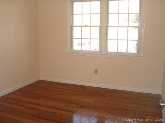 55 Mill Plain Rd Unit 17-6, Danbury, CT 06811 - empty room featuring wood finished floors and baseboards
