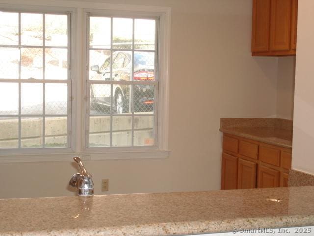 55 Mill Plain Rd Unit 17-6, Danbury, CT 06811 - kitchen with light stone countertops