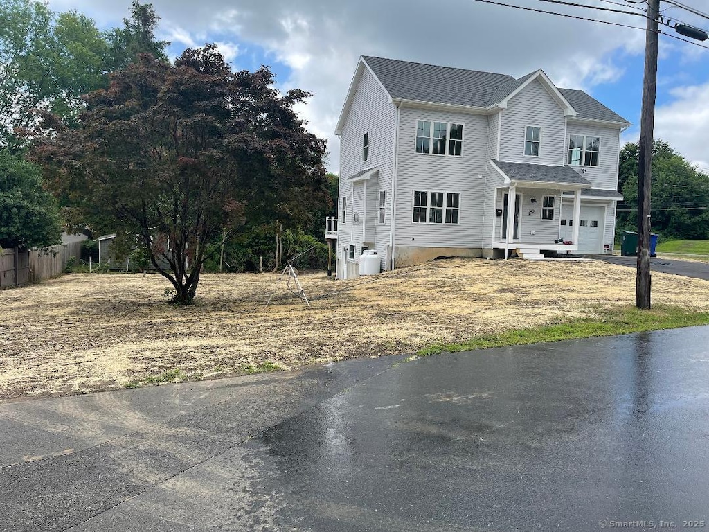30 Bayberry Ln, Stratford, CT 06614 - view of front facade featuring a garage and driveway