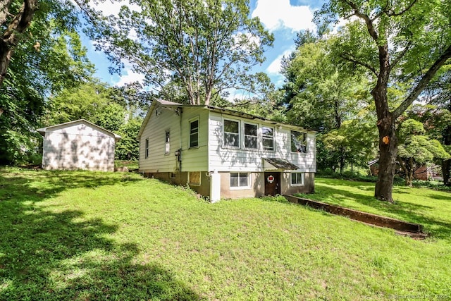 16 Oak St, New Fairfield, CT 06812 - rear view of house featuring a lawn