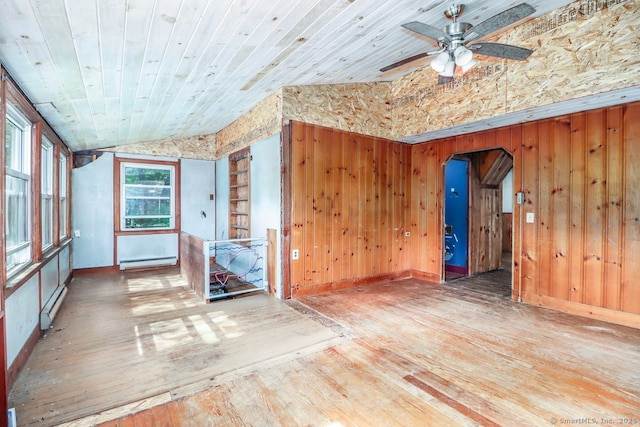 16 Oak St, New Fairfield, CT 06812 - empty room with hardwood / wood-style flooring, wooden walls, a ceiling fan, baseboard heating, and wooden ceiling