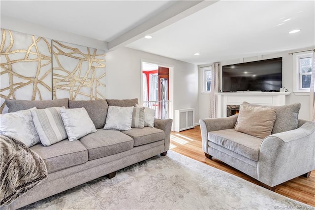 12 Sunset Ave, Trumbull, CT 06611 - living area featuring wood finished floors, recessed lighting, radiator heating unit, and beamed ceiling