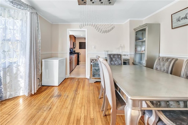 12 Sunset Ave, Trumbull, CT 06611 - dining room featuring light wood-style floors and crown molding