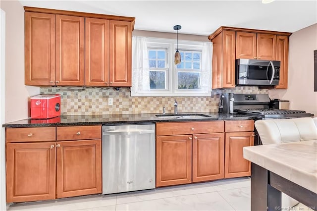 12 Sunset Ave, Trumbull, CT 06611 - kitchen with stainless steel appliances, brown cabinetry, backsplash, and light marble finish floors