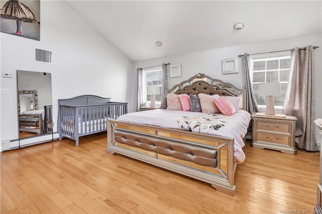 12 Sunset Ave, Trumbull, CT 06611 - bedroom featuring light wood-style flooring, baseboard heating, and high vaulted ceiling