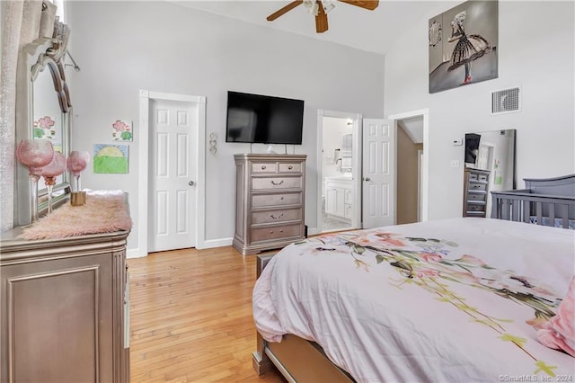 12 Sunset Ave, Trumbull, CT 06611 - bedroom with high vaulted ceiling, light wood-style flooring, ensuite bath, and ceiling fan