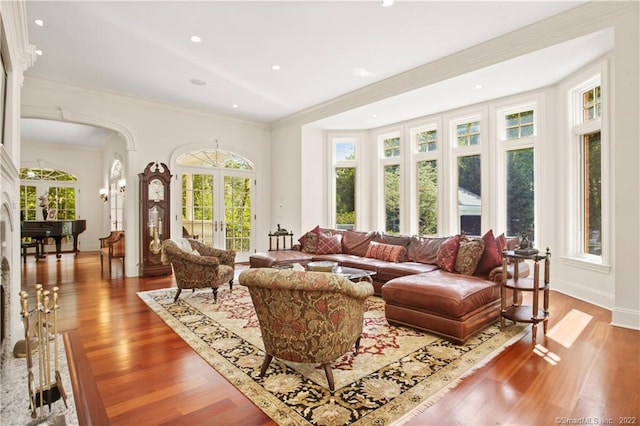 living room featuring crown molding and light wood-type flooring