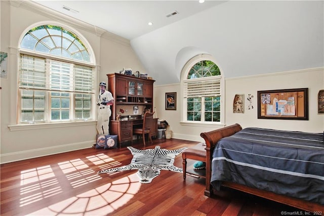 bedroom with dark hardwood / wood-style flooring, crown molding, and vaulted ceiling